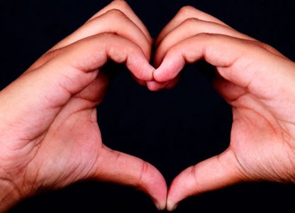 hands formed in a heart shape