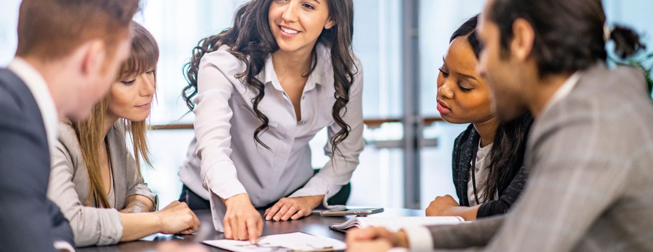 A corporate setting with colleagues in a meeting