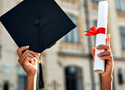 A graduation cap and scroll