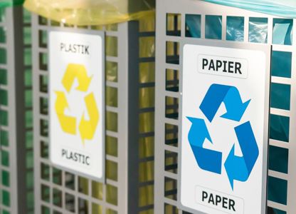 Three rubbish bins in a row