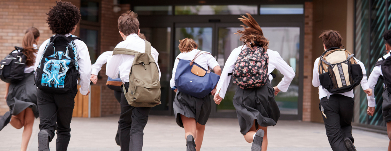 School children running in the playground